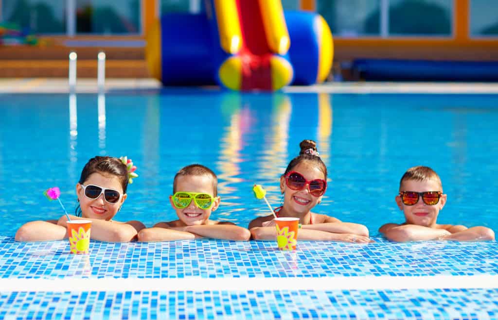 group of happy teenage kids in the pool